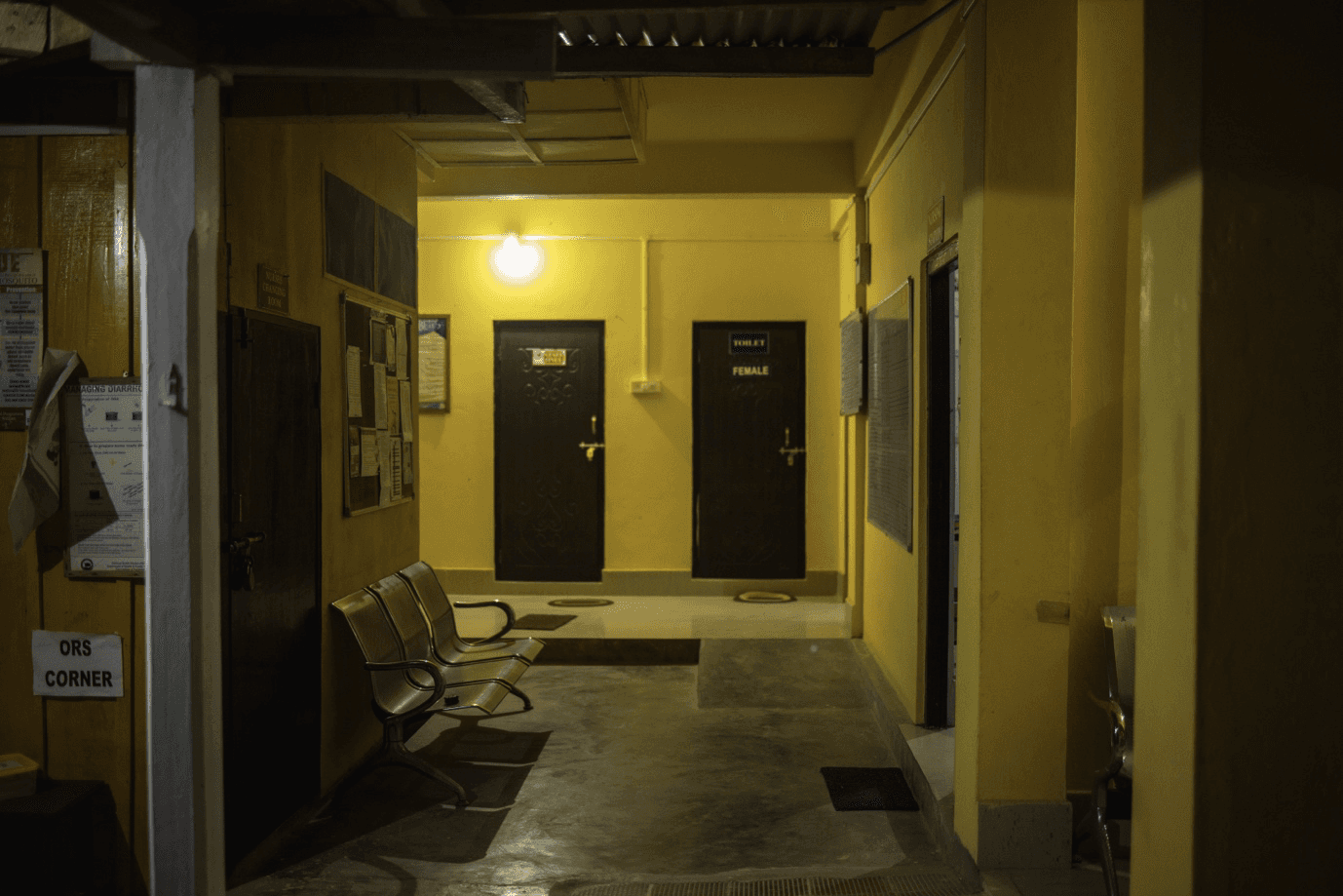 Healthcare center lit up at night, powered bySunmeister's MULE,  an off-grid/hybrid solar installation with energy stored in its battery