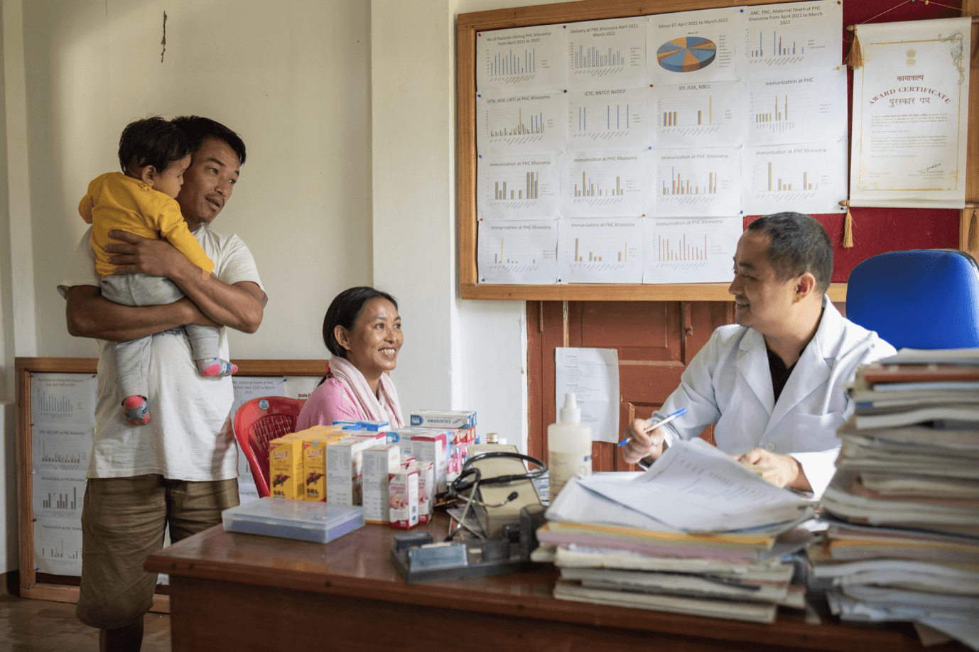 A family consulting with a doctor in a primary healthcare center in Nagaland, which is powered by Sunmeister's MULE,  an off-grid/hybrid solar installation