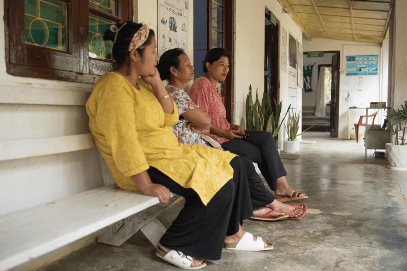 Three patients waiting for consultation in a primary healthcare center powered by Sunmeister's MULE,  an off-grid/hybrid solar installation