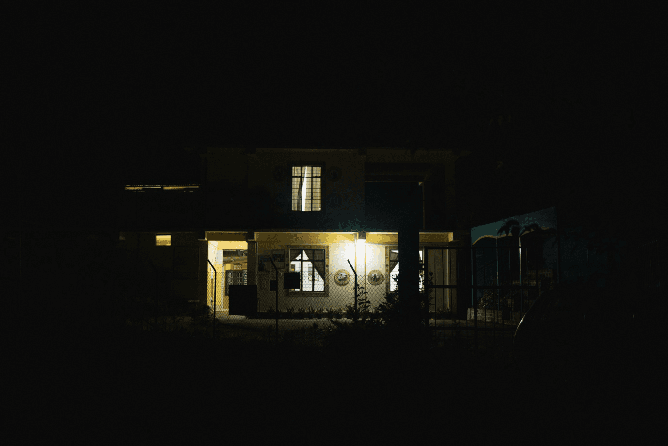 A house illuminated at night, powered by Sunmeister's hybrid solar system