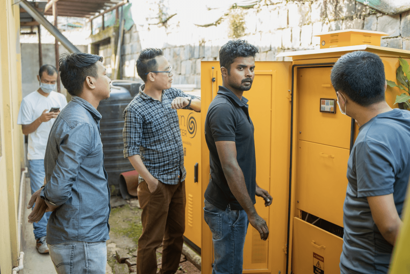 Sunmeister engineers installing the MULE plug-and-play solar hybrid system in a primary healthcare center
