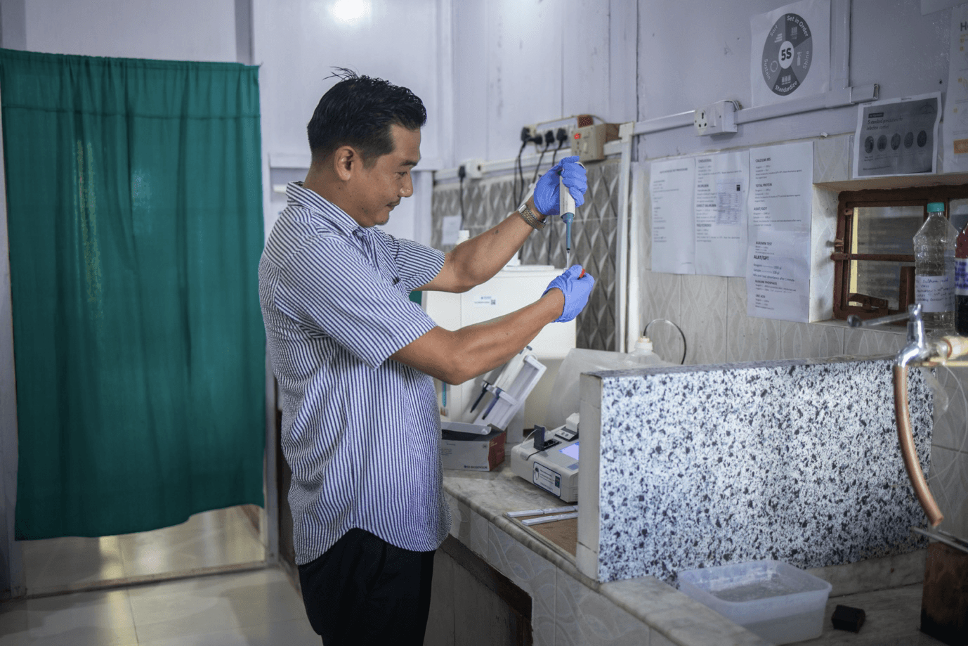 Hospital staff working with an uninterrupted power supply from Sunmeister's MULE,  an off-grid/hybrid solar installation